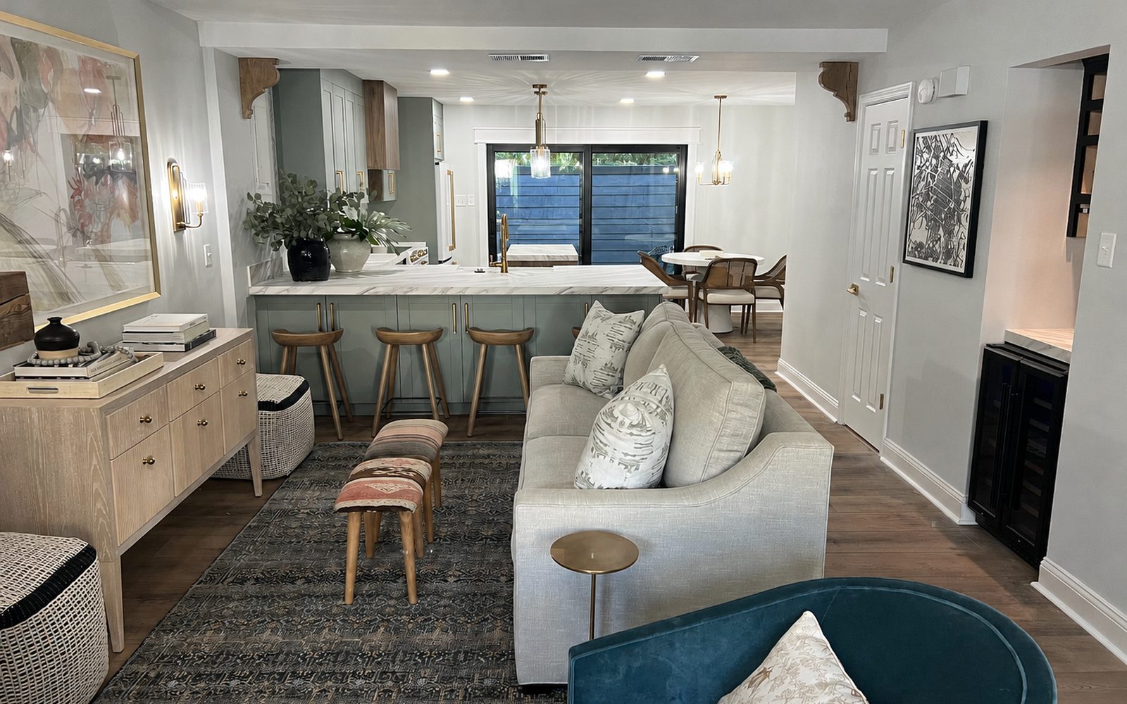 Kitchen after restoration: white shaker cabinets, granite, stainless appliances