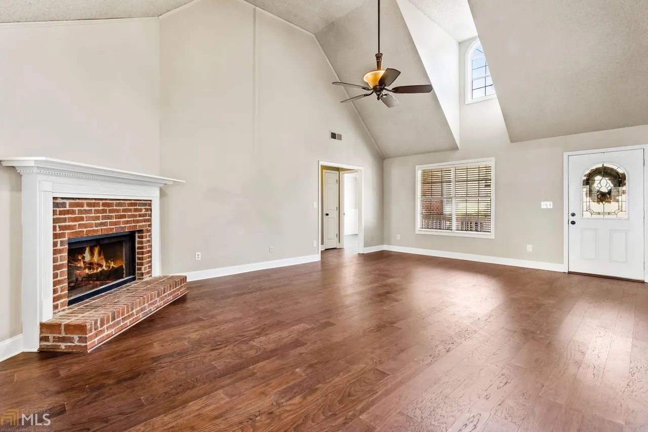 Living room with brick fireplace